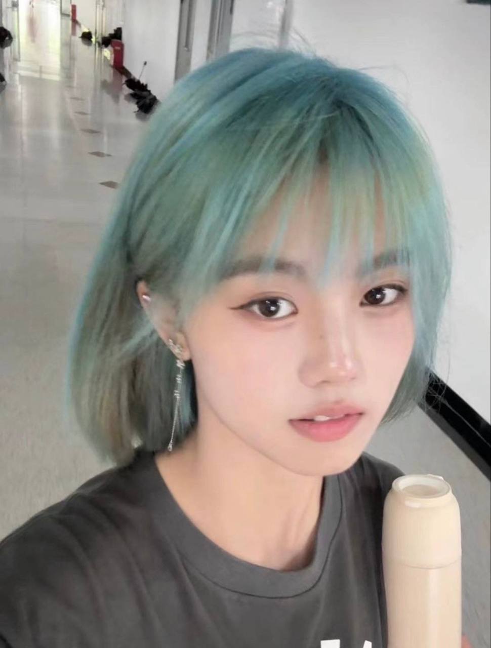 A rebellious blue-haired tender sister with tender, full-faced tits that look